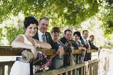 wedding party on footbridge by kootenay wedding photographer electrify photography