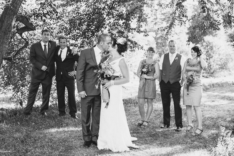 black and white wedding party with a kiss by kootenay wedding photographer electrify photography