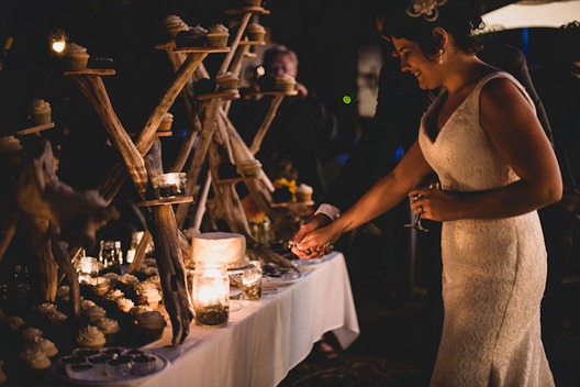 cutting the cake by kootenay wedding photographer electrify photography