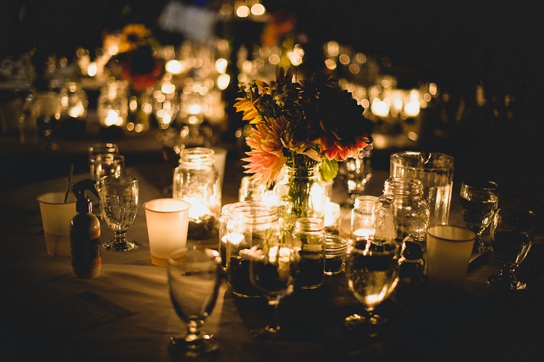 glowing candle mason jar centerpiece by kootenay wedding photographer electrify photography