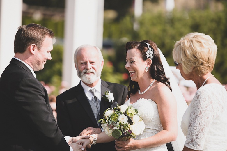 bride handed off by mother and father at vintage okanagan wedding by nelson, kelowna, bc, wedding photographer electrify photography