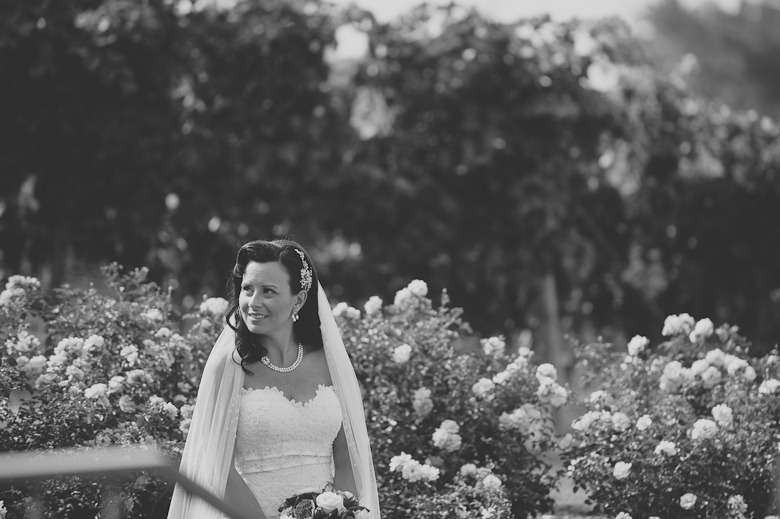 bride in the roses, black and white, at vintage okanagan wedding by nelson, kelowna, bc, wedding photographer electrify photography