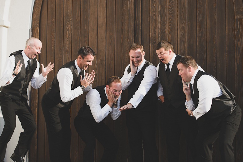 groomsmen exclaim over groom's ring at vintage okanagan wedding by nelson, kelowna, bc, wedding photographer electrify photography