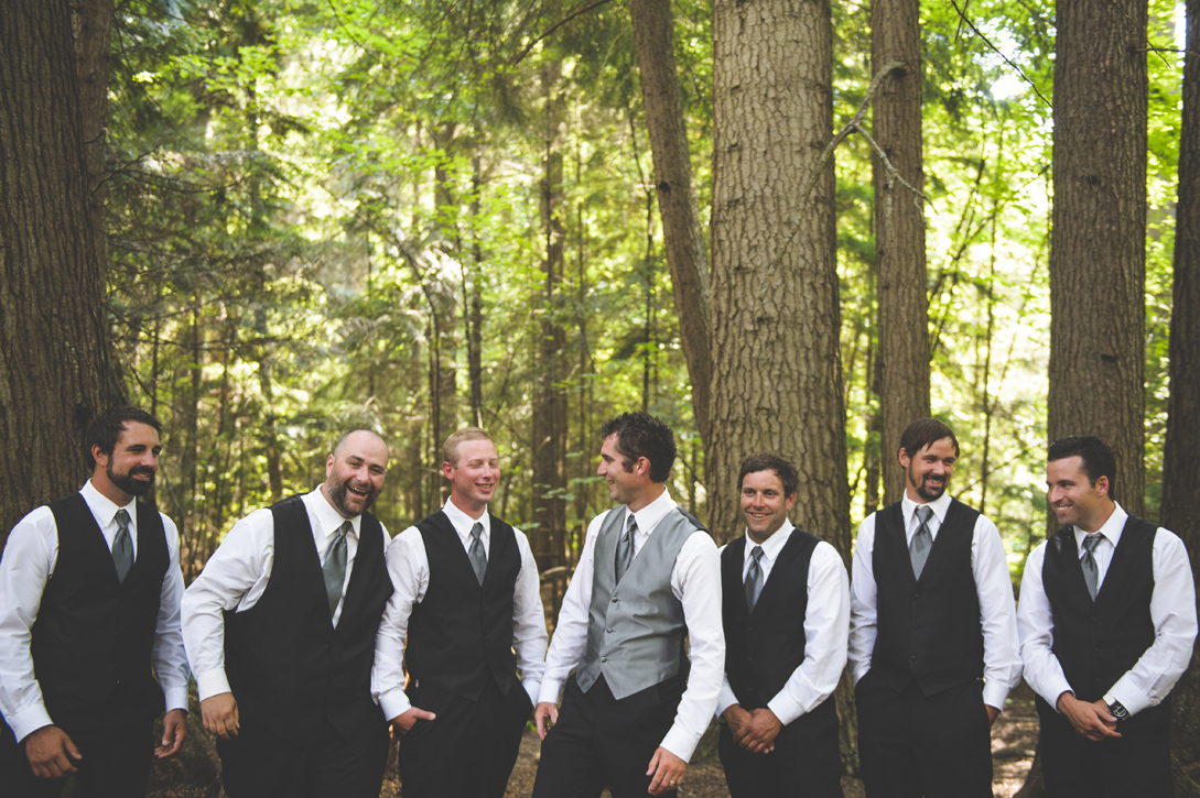 Groomsmen laugh together at Kokanee Creek Park, by Nelson BC Kootenay wedding photographer Emilee Zaitsoff of Electrify Photograph