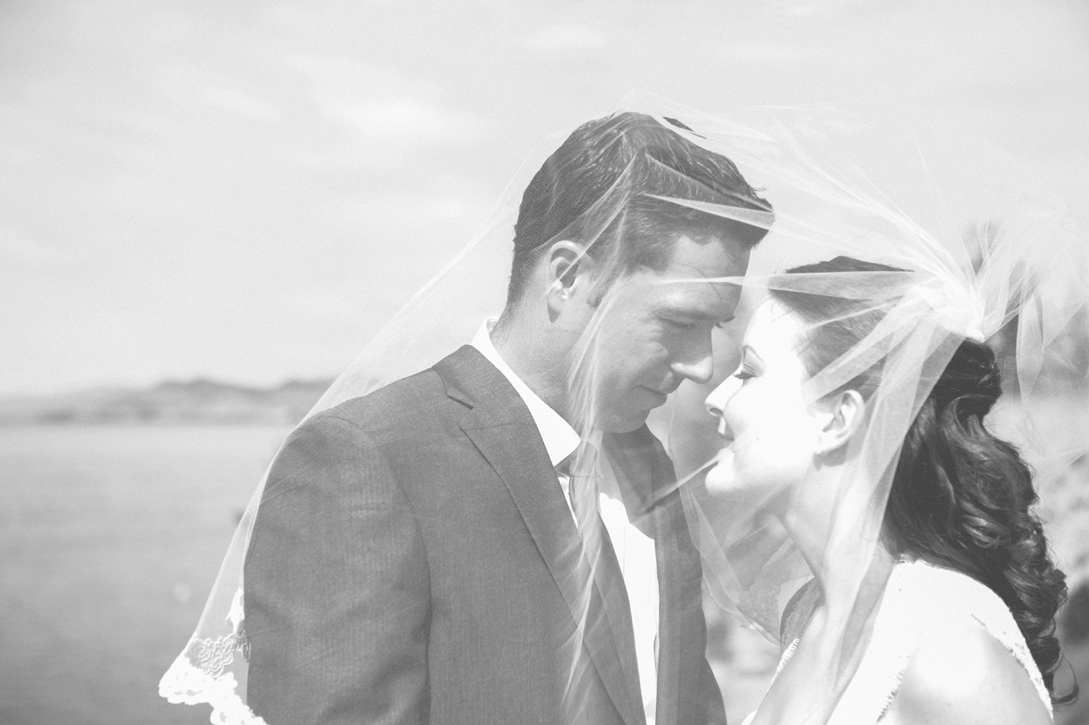 Bride and groom with vintage veil in black and white with grain near Kelowna, BC, Okanagan by Nelson BC Kootenay wedding photographer Emilee Zaitsoff of Electrify Photography