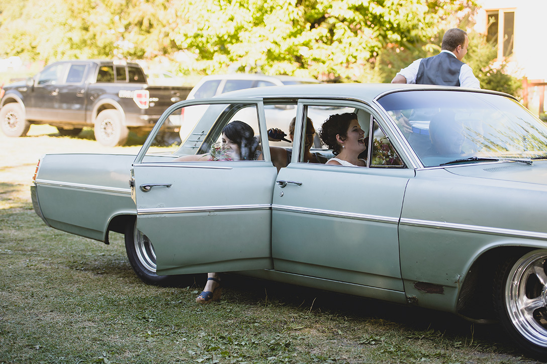 Vintage car for the bridal party at rustic Kootenay Wedding by Electrify Photography.