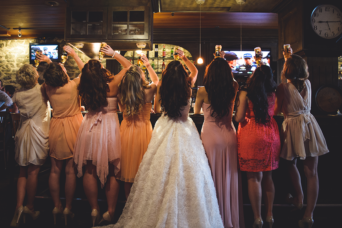Bridesmaids have a little fun at the bar, Jackson's Hole, Nelson, BC by Kootenay wedding photographer Electrify Photography