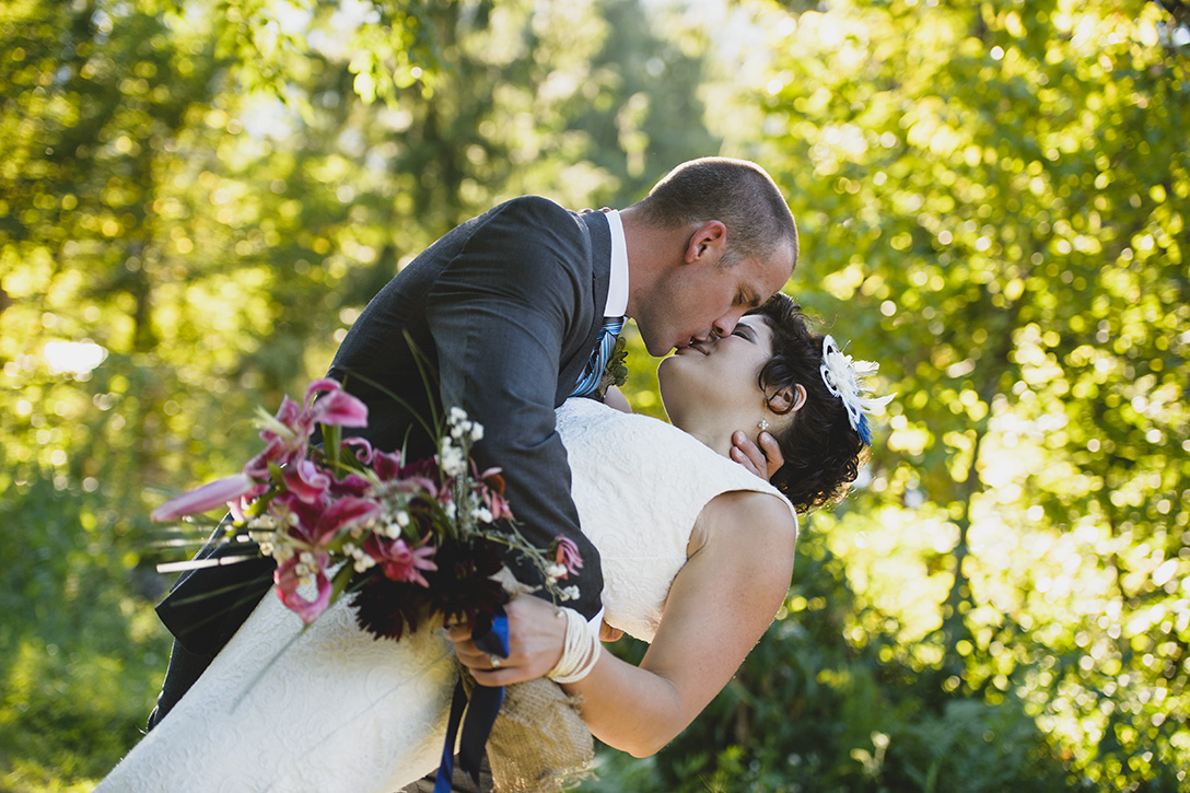 Bride and Groom kiss at rustic Kootenay Wedding by Electrify Photography.