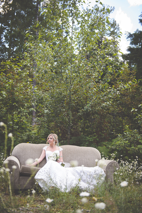 Bride on a couch in the forest, red mountain, rossland, by Nelson BC Kootenay wedding photographer Emilee Zaitsoff of Electrify Photograph
