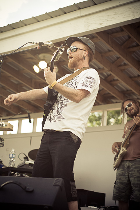 Gisto of Wassabi Collective plays electric guitar at the Grand Forks Fall Faire, photo by Electrify Photography